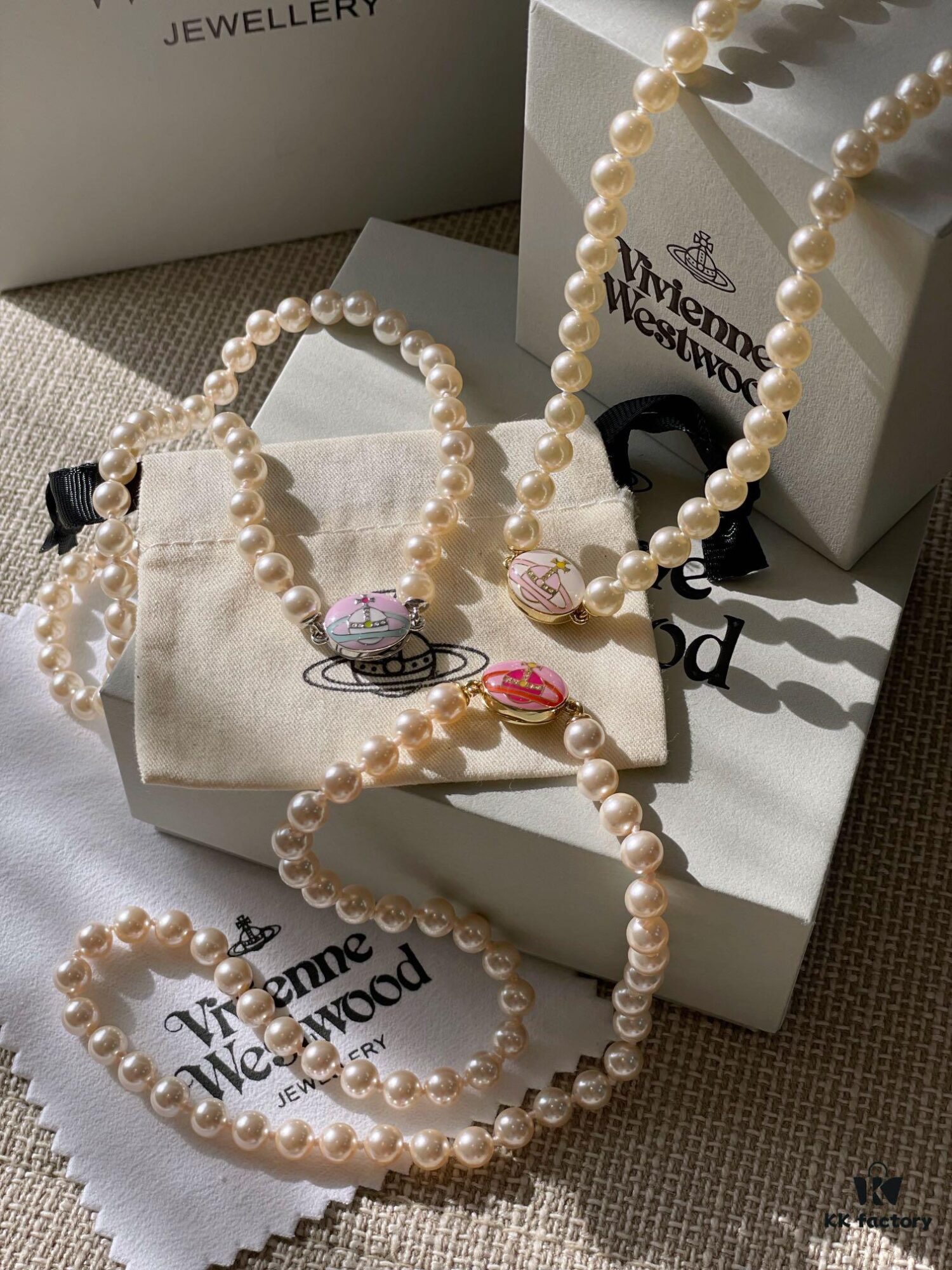 Vivienne Westwood Enamel Pearl Necklace with Magnetic Clasp, Double-Sided Wear, Saturn and Crown Design, Elegant and Edgy Style