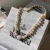 Vivienne Westwood Enamel Pearl Necklace with Magnetic Clasp, Double-Sided Wear, Saturn and Crown Design, Elegant and Edgy Style