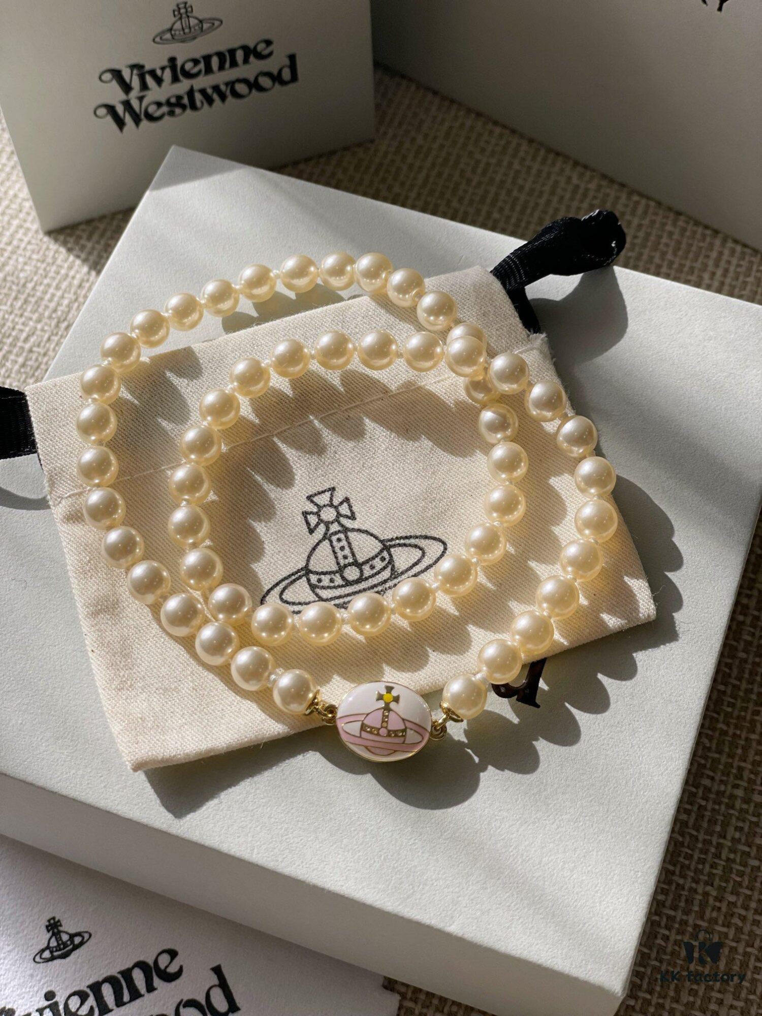 Vivienne Westwood Enamel Pearl Necklace with Magnetic Clasp, Double-Sided Wear, Saturn and Crown Design, Elegant and Edgy Style