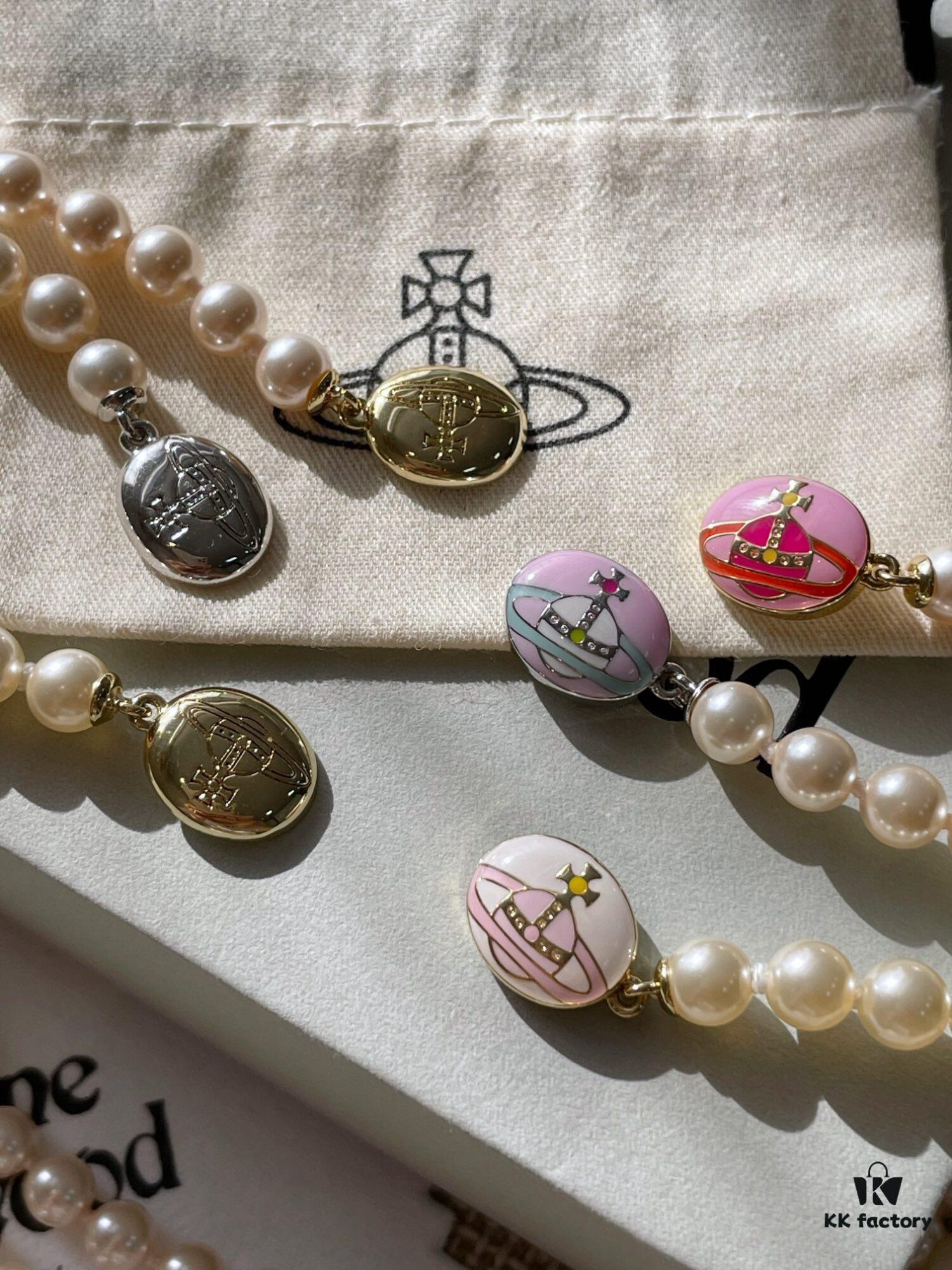 Vivienne Westwood Enamel Pearl Necklace with Magnetic Clasp, Double-Sided Wear, Saturn and Crown Design, Elegant and Edgy Style