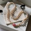 Vivienne Westwood Enamel Pearl Necklace with Magnetic Clasp, Double-Sided Wear, Saturn and Crown Design, Elegant and Edgy Style