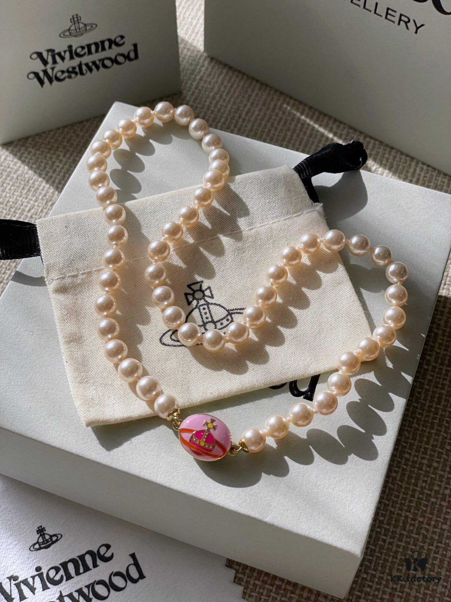 Vivienne Westwood Enamel Pearl Necklace with Magnetic Clasp, Double-Sided Wear, Saturn and Crown Design, Elegant and Edgy Style