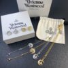 West Queen Half-Moon Saturn Ear Studs Bracelet Necklace Set in Gold and Silver Tones