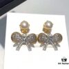 Miu Miu Bow Knot Stud Earrings, Guo Biting Same Style, Princess-like Charm, Dual-tone Gold-plated Craft with Swarovski Pearl