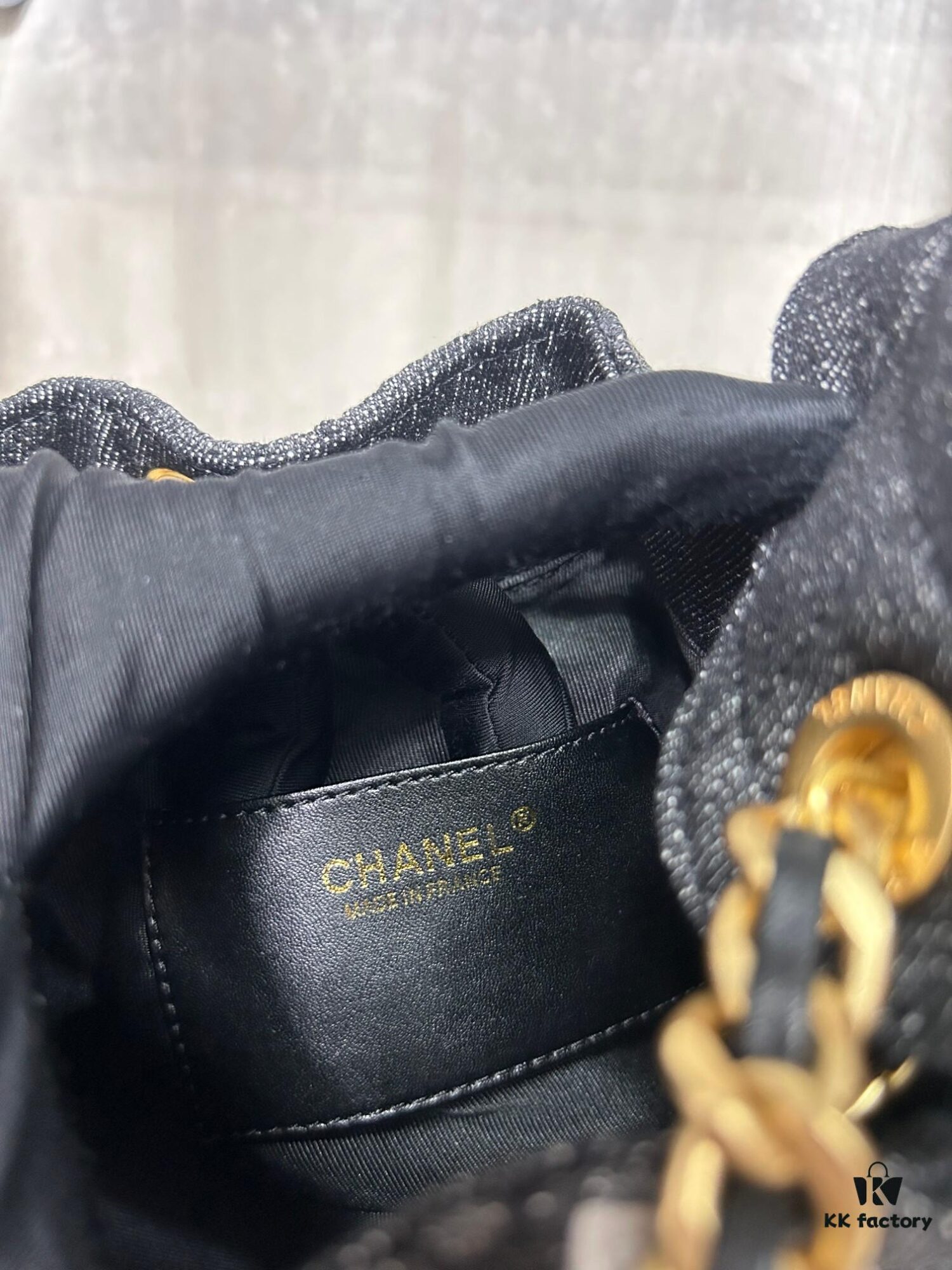 Chanel Washed Denim 25C Hobo Bag with Quilted Ball Texture, Vintage Coin Button Drawstring Bucket Bag in Retro Black and Gold with Diamond Stitching, Classic Chain Design