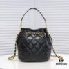 Chanel Vintage Drawstring Button Bag Made of Lambskin with Classic Quilting and Chain-in-Leather Strap