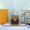 Upgraded Original Version [Exclusive Real Photo M82952 Monogram. Yellow Flower] This Nano Cannes Handbag features a cylindrical silhouette crafted from Monogram canvas, echoing the design of a makeup pouch.