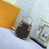 Upgraded Original Version [Exclusive Real Photo M82952 Monogram. Yellow Flower] This Nano Cannes Handbag features a cylindrical silhouette crafted from Monogram canvas, echoing the design of a makeup pouch.