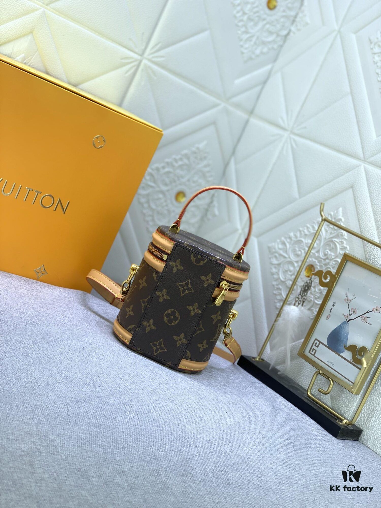 Upgraded Original Version [Exclusive Real Photo M82952 Monogram. Yellow Flower] This Nano Cannes Handbag features a cylindrical silhouette crafted from Monogram canvas, echoing the design of a makeup pouch.