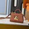 Upgraded Original M21590 M59090 Twist One Handle BB Handbag crafted from deeply dyed Taurillon leather, featuring a top single handle and the iconic LV Twist turn-lock flap closure. The contrasting color leather lining adds a fashionable touch, suitable for crossbody, shoulder, or handheld wear.