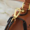 Upgraded Original M21590 M59090 Twist One Handle BB Handbag crafted from deeply dyed Taurillon leather, featuring a top single handle and the iconic LV Twist turn-lock flap closure. The contrasting color leather lining adds a fashionable touch, suitable for crossbody, shoulder, or handheld wear.