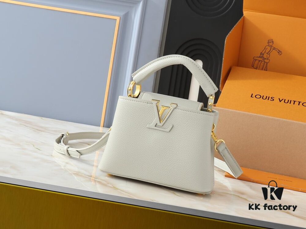 Upgraded Original M24728 M24736 M25087 M24655 M24656 M24733 M24729 M25090 M12785 M24727 M24745 This Mini Capucines Bag is crafted from refined Taurillon leather, accented with glossy handle rings and the signature LV initials to highlight its compact silhouette. The detachable shoulder strap allows versatile styling as a shoulder or crossbody bag. Dimensions: 21.0 x 13.6 x 8.0 cm (Length x Height x Width)