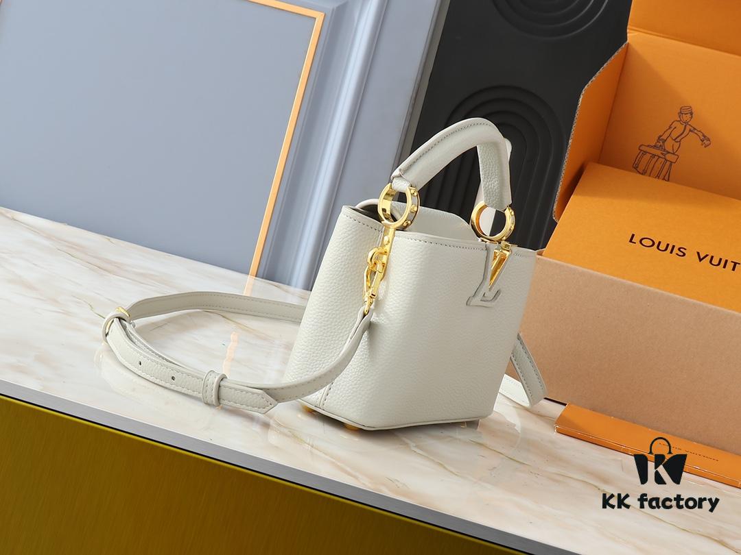 Upgraded Original M24728 M24736 M25087 M24655 M24656 M24733 M24729 M25090 M12785 M24727 M24745 This Mini Capucines Bag is crafted from refined Taurillon leather, accented with glossy handle rings and the signature LV initials to highlight its compact silhouette. The detachable shoulder strap allows versatile styling as a shoulder or crossbody bag. Dimensions: 21.0 x 13.6 x 8.0 cm (Length x Height x Width)