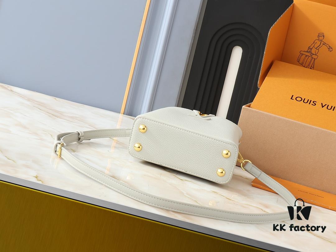 Upgraded Original M24728 M24736 M25087 M24655 M24656 M24733 M24729 M25090 M12785 M24727 M24745 This Mini Capucines Bag is crafted from refined Taurillon leather, accented with glossy handle rings and the signature LV initials to highlight its compact silhouette. The detachable shoulder strap allows versatile styling as a shoulder or crossbody bag. Dimensions: 21.0 x 13.6 x 8.0 cm (Length x Height x Width)