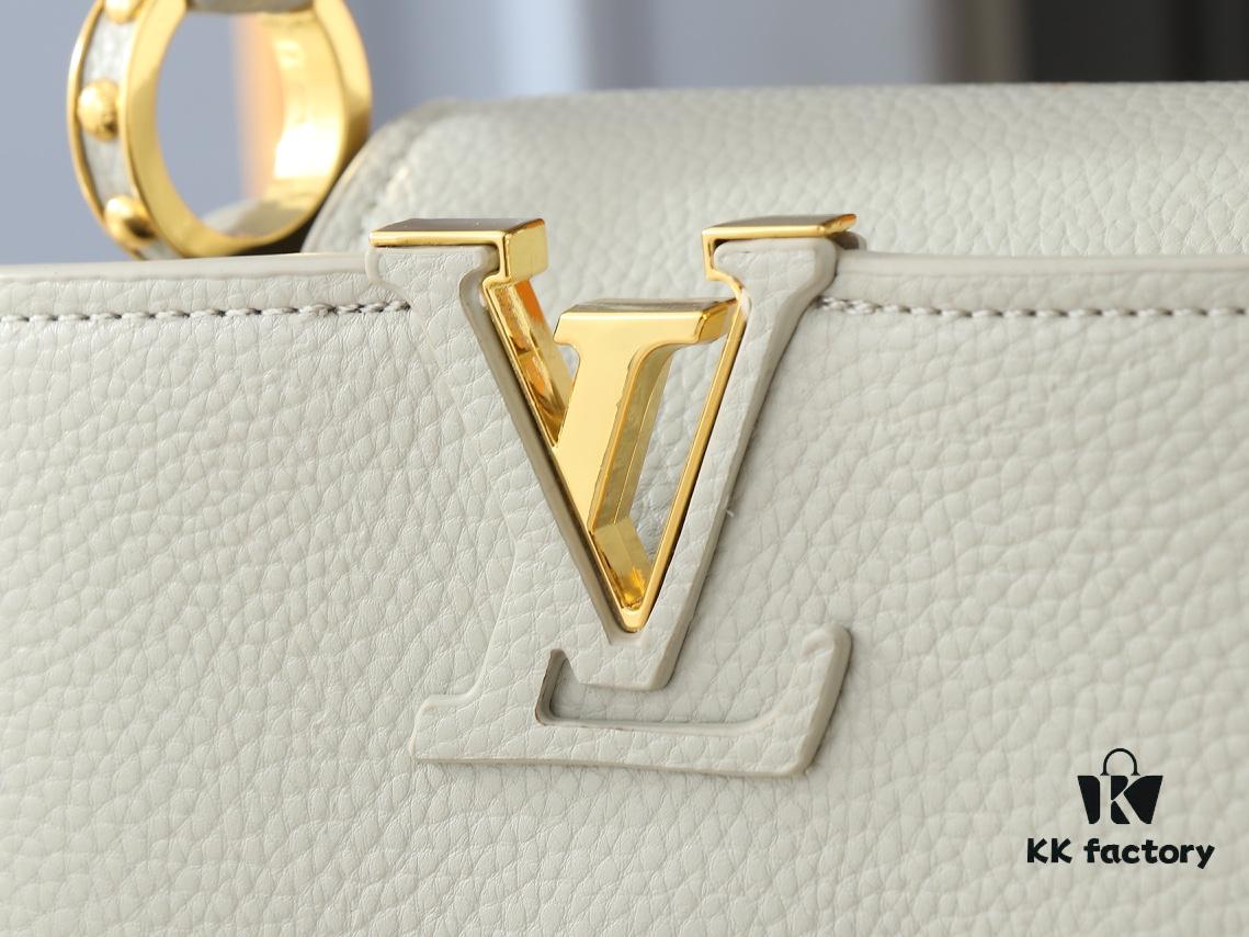 Upgraded Original M24728 M24736 M25087 M24655 M24656 M24733 M24729 M25090 M12785 M24727 M24745 This Mini Capucines Bag is crafted from refined Taurillon leather, accented with glossy handle rings and the signature LV initials to highlight its compact silhouette. The detachable shoulder strap allows versatile styling as a shoulder or crossbody bag. Dimensions: 21.0 x 13.6 x 8.0 cm (Length x Height x Width)