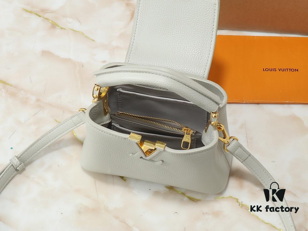 Upgraded Original M24728 M24736 M25087 M24655 M24656 M24733 M24729 M25090 M12785 M24727 M24745 This Mini Capucines Bag is crafted from refined Taurillon leather, accented with glossy handle rings and the signature LV initials to highlight its compact silhouette. The detachable shoulder strap allows versatile styling as a shoulder or crossbody bag. Dimensions: 21.0 x 13.6 x 8.0 cm (Length x Height x Width)