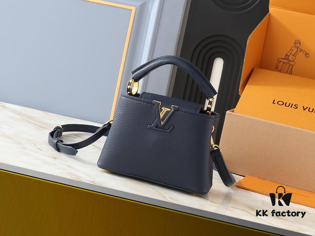 Upgraded Original M24728 M24736 M25087 M24655 M24656 M24733 M24729 M25090 M12785 M24727 M24745 This Mini Capucines Bag is crafted from refined Taurillon leather, accentuated by a lustrous handle ring and the iconic LV letter motif that enhances its compact silhouette. Featuring a detachable shoulder strap for versatile styling as a shoulder or crossbody bag. Dimensions: 21.0 x 13.6 x 8.0 cm (Length x Height x Width)