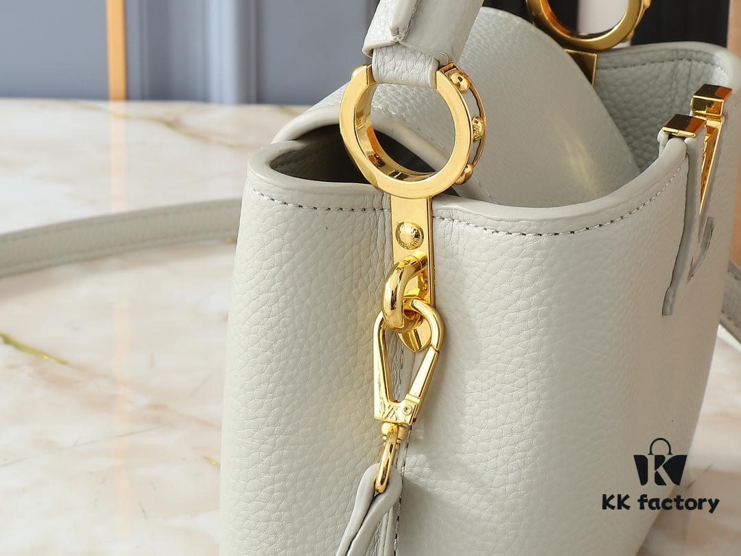 Upgraded Original M24728 M24736 M25087 M24655 M24656 M24733 M24729 M25090 M12785 M24727 M24745 This Mini Capucines Bag is crafted from refined Taurillon leather, accented with glossy handle rings and the signature LV initials to highlight its compact silhouette. The detachable shoulder strap allows versatile styling as a shoulder or crossbody bag. Dimensions: 21.0 x 13.6 x 8.0 cm (Length x Height x Width)