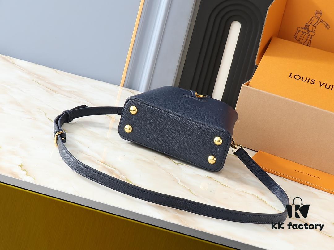 Upgraded Original M24728 M24736 M25087 M24655 M24656 M24733 M24729 M25090 M12785 M24727 M24745 This Mini Capucines Bag is crafted from refined Taurillon leather, accentuated by a lustrous handle ring and the iconic LV letter motif that enhances its compact silhouette. Featuring a detachable shoulder strap for versatile styling as a shoulder or crossbody bag. Dimensions: 21.0 x 13.6 x 8.0 cm (Length x Height x Width)