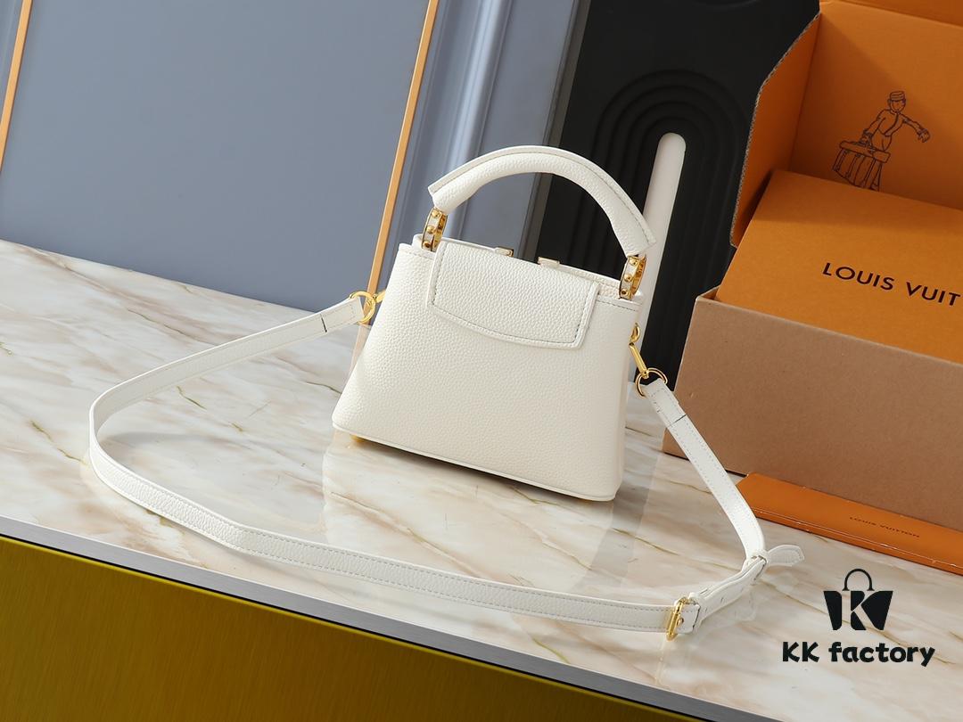 Upgraded Original M24728 M24736 M25087 M24655 M24656 M24733 M24729 M25090 M12785 M24727 M24745 This Mini Capucines Bag is crafted from refined Taurillon leather, accentuated by a lustrous handle ring and the signature LV lettering that enhances its compact silhouette. The detachable shoulder strap allows for versatile styling as a shoulder or crossbody bag. Dimensions: 21.0 x 13.6 x 8.0 cm (L x H x W)