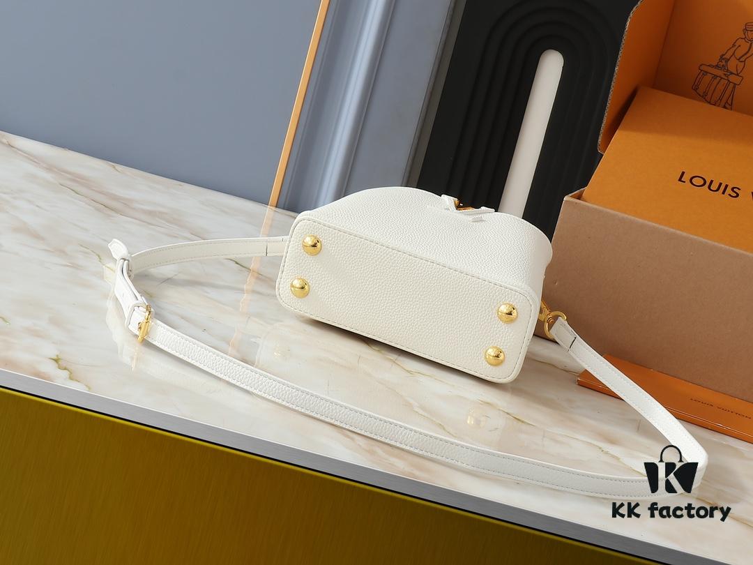 Upgraded Original M24728 M24736 M25087 M24655 M24656 M24733 M24729 M25090 M12785 M24727 M24745 This Mini Capucines Bag is crafted from refined Taurillon leather, accentuated by a lustrous handle ring and the signature LV lettering that enhances its compact silhouette. The detachable shoulder strap allows for versatile styling as a shoulder or crossbody bag. Dimensions: 21.0 x 13.6 x 8.0 cm (L x H x W)