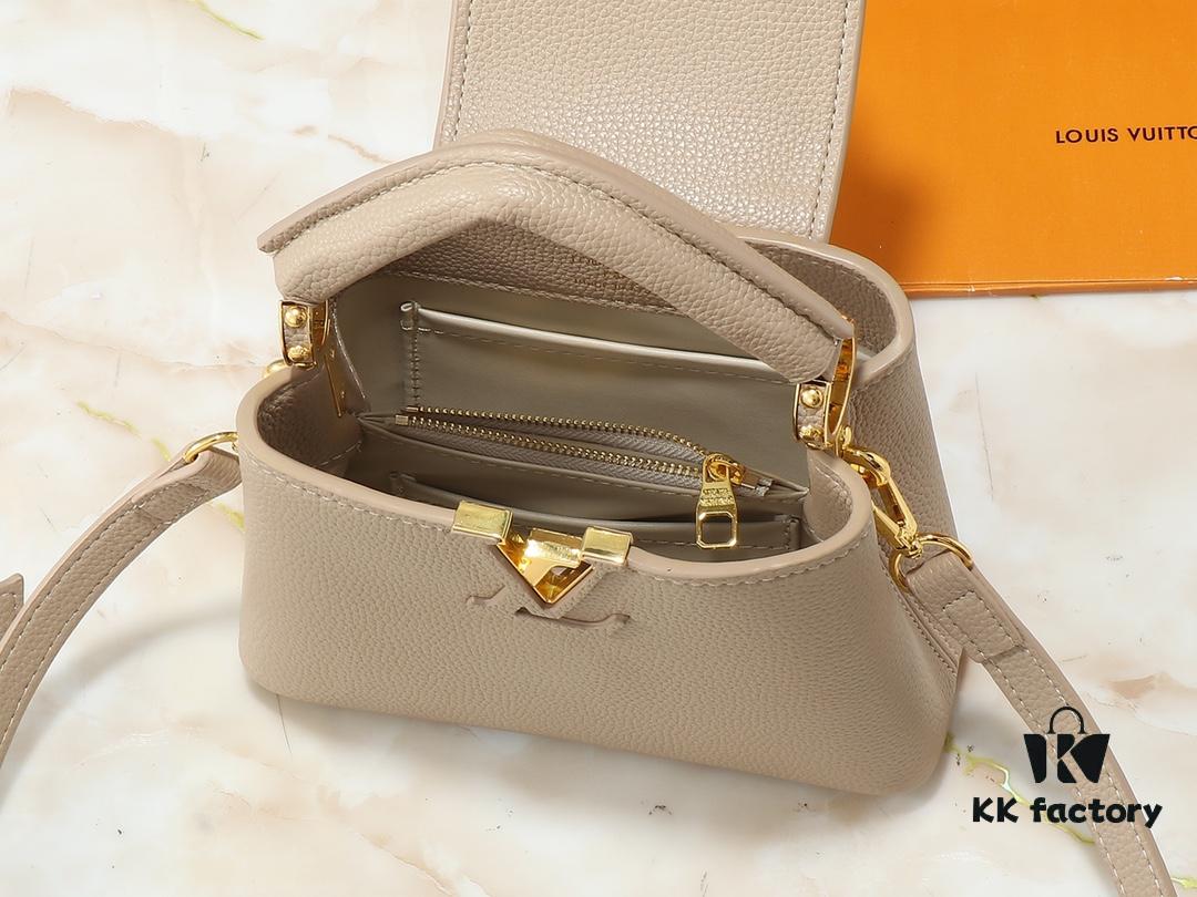 Upgraded Original M24728 M24736 M25087 M24655 M24656 M24733 M24729 M25090 M12785 M24727 M24745 This Capucines Mini Bag is crafted from refined Taurillon calf leather, accentuated by lustrous handle rings and the iconic LV letter signature, enhancing its compact silhouette. The detachable shoulder strap allows versatile styling as a shoulder or crossbody bag. Dimensions: 21.0 x 13.6 x 8.0 cm (L x H x W)