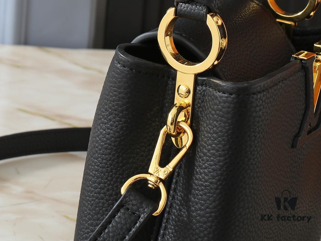 Upgraded Original M24728 M24736 M25087 M24655 M24656 M24733 M24729 M25090 M12785 M24727 M24745 This Mini Capucines Bag is crafted from refined Taurillon leather, accentuated by lustrous handle rings and the iconic LV lettering that highlights its compact silhouette. Featuring a detachable shoulder strap for versatile styling as a shoulder or crossbody bag. Dimensions: 21.0 x 13.6 x 8.0 cm (L x H x W)