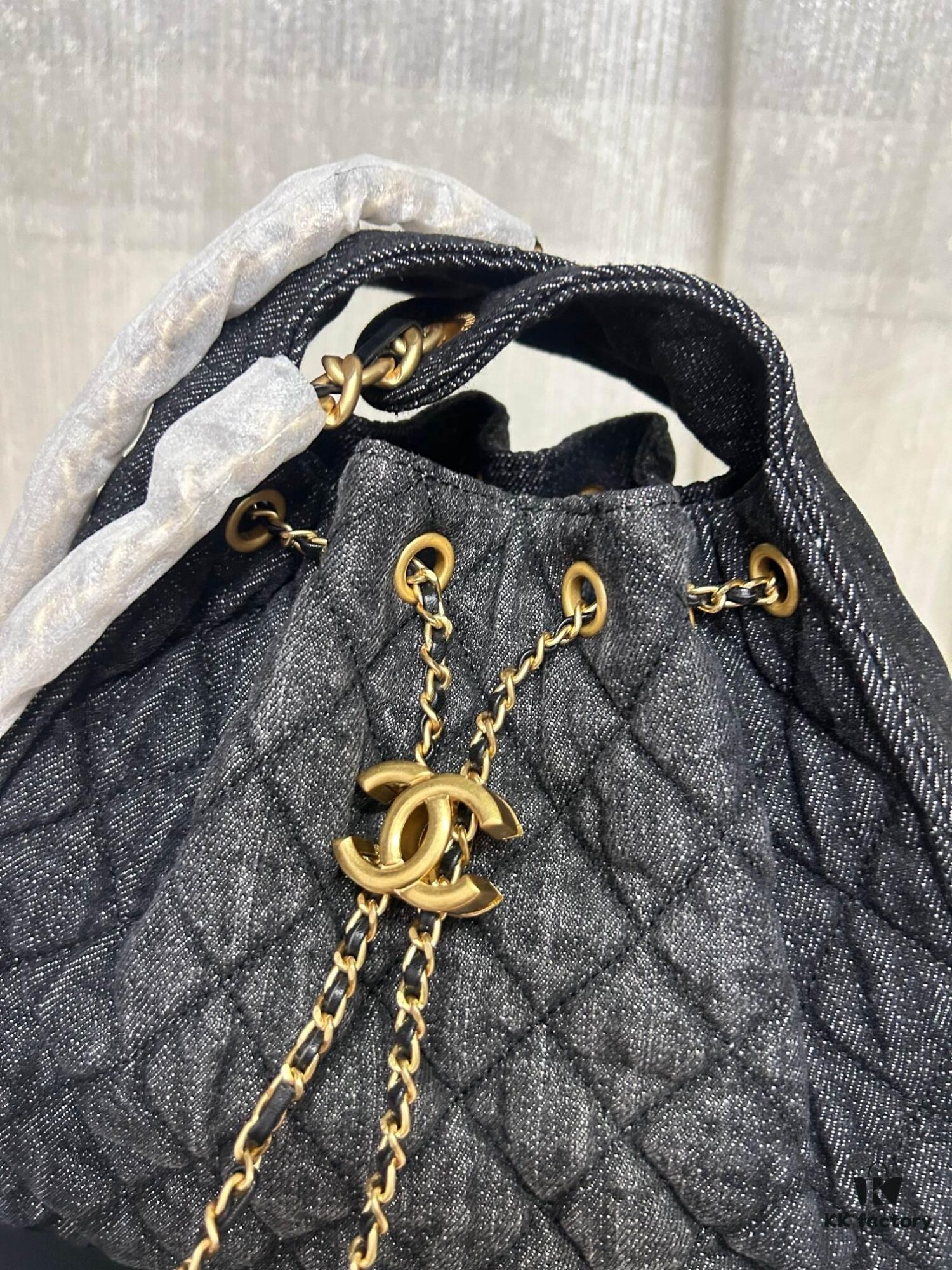 Chanel Washed Denim 25C Hobo Bag with Quilted Ball Texture, Vintage Coin Button Drawstring Bucket Bag in Retro Black and Gold with Diamond Stitching, Classic Chain Design