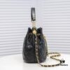 Chanel Vintage Drawstring Button Bag Made of Lambskin with Classic Quilting and Chain-in-Leather Strap