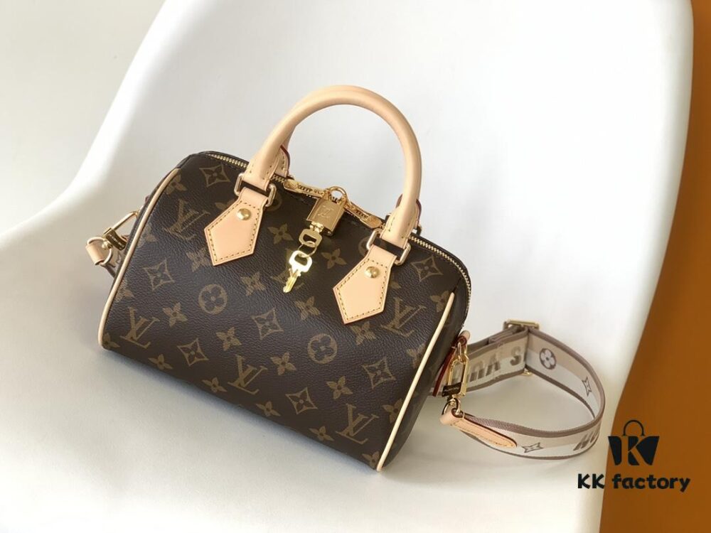 M46222 Beige M46234 Black [M45957 Black Adjustable Strap Not Available] ~ This Speedy Bandoulière 20 Handbag features Monogram canvas, cowhide leather trim, and textile lining, continuing the classic Louis Vuitton Speedy travel bag design in a compact size, complete with rolled leather handles and a detachable, adjustable fabric shoulder strap accented with signature woven branding