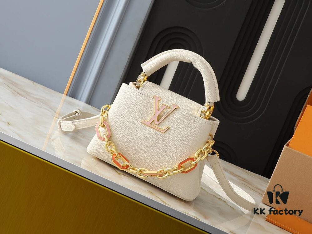Upgraded Original M24683 M25232 M24684 M25211 This Capucines Mini Bag is crafted from vibrant Taurillon calf leather, featuring a delicate chain with octagonal links adorned with colorful enamel, illustrating the Art Deco design concept. 3D LV letters add a fresh touch. Dimensions: 21.0 x 14.0 x 8.0 cm (Length x Height x Width)