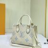 Upgraded Original M46833 White M45653 White Embossed M46569 This OnTheGo PM Bag Features Monogram Empreinte Leather with Subtle Tones Highlighting the LV Initials and Monogram Flowers Embossing Giving a Compact Square Silhouette a Delicate Sheen