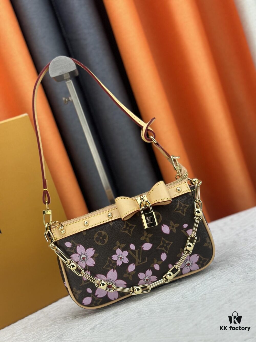 M13666 Pochette Accessoires Bag – A playful interpretation of the iconic Monogram canvas with Takashi Murakami's vibrant Cherry Blossom motif, revisiting the Louis Vuitton x Murakami collaboration with bold, whimsical style.