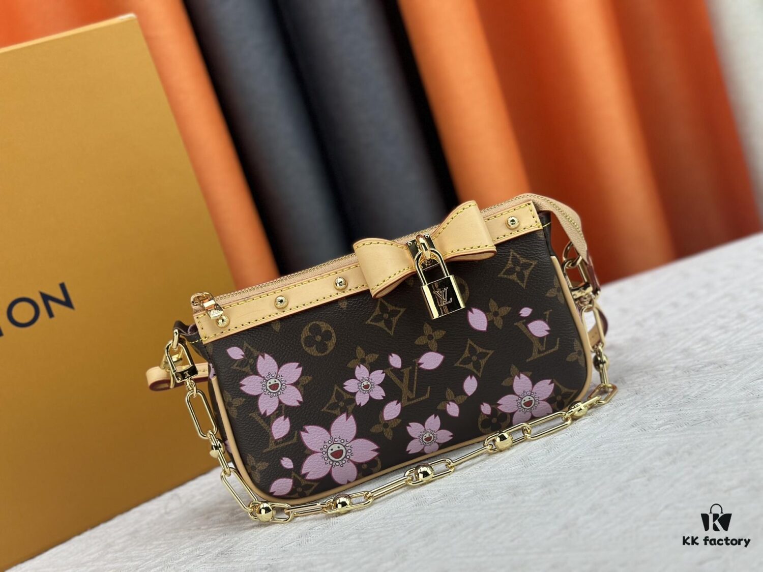 M13666 Pochette Accessoires Bag – A playful interpretation of the iconic Monogram canvas with Takashi Murakami's vibrant Cherry Blossom motif, revisiting the Louis Vuitton x Murakami collaboration with bold, whimsical style.