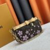 M13666 Pochette Accessoires Bag – A playful interpretation of the iconic Monogram canvas with Takashi Murakami's vibrant Cherry Blossom motif, revisiting the Louis Vuitton x Murakami collaboration with bold, whimsical style.