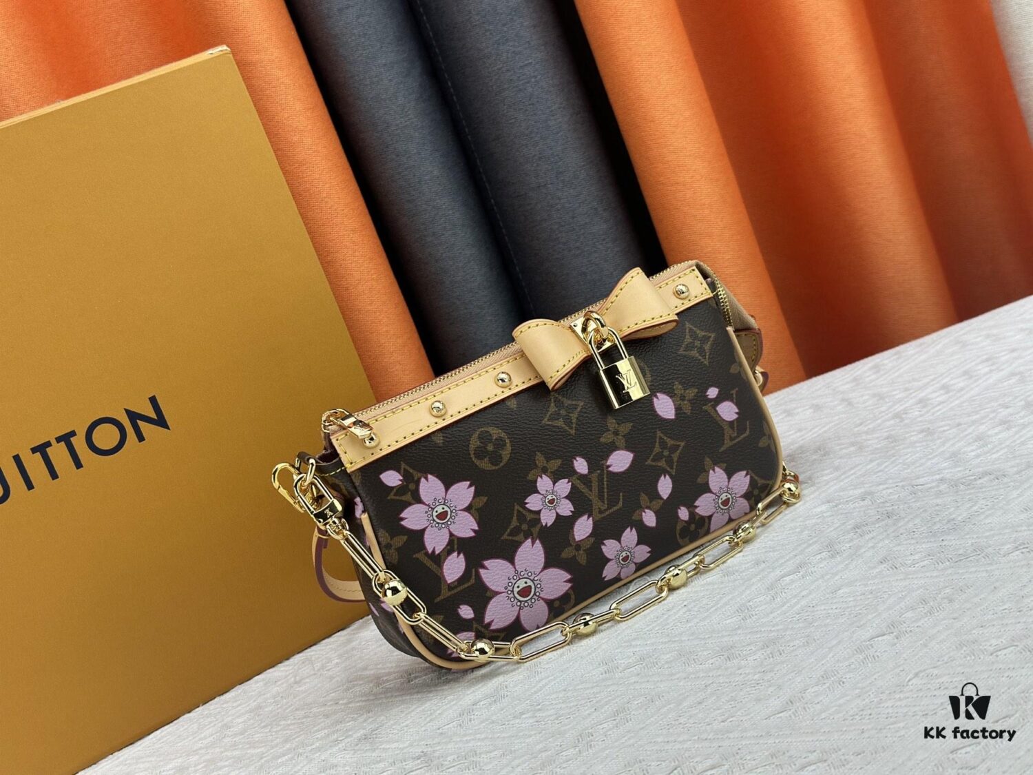 M13666 Pochette Accessoires Bag – A playful interpretation of the iconic Monogram canvas with Takashi Murakami's vibrant Cherry Blossom motif, revisiting the Louis Vuitton x Murakami collaboration with bold, whimsical style.