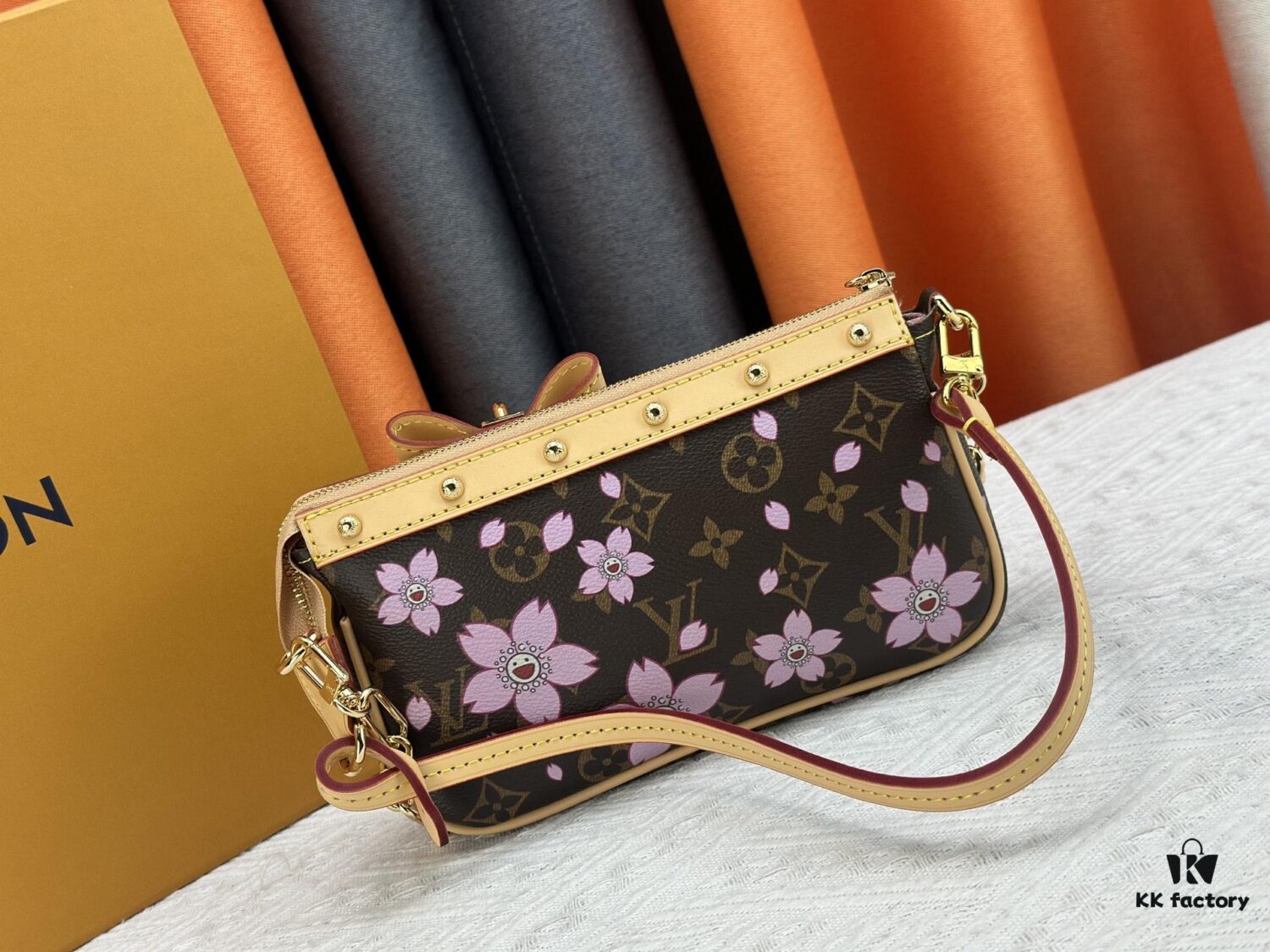 M13666 Pochette Accessoires Bag – A playful interpretation of the iconic Monogram canvas with Takashi Murakami's vibrant Cherry Blossom motif, revisiting the Louis Vuitton x Murakami collaboration with bold, whimsical style.
