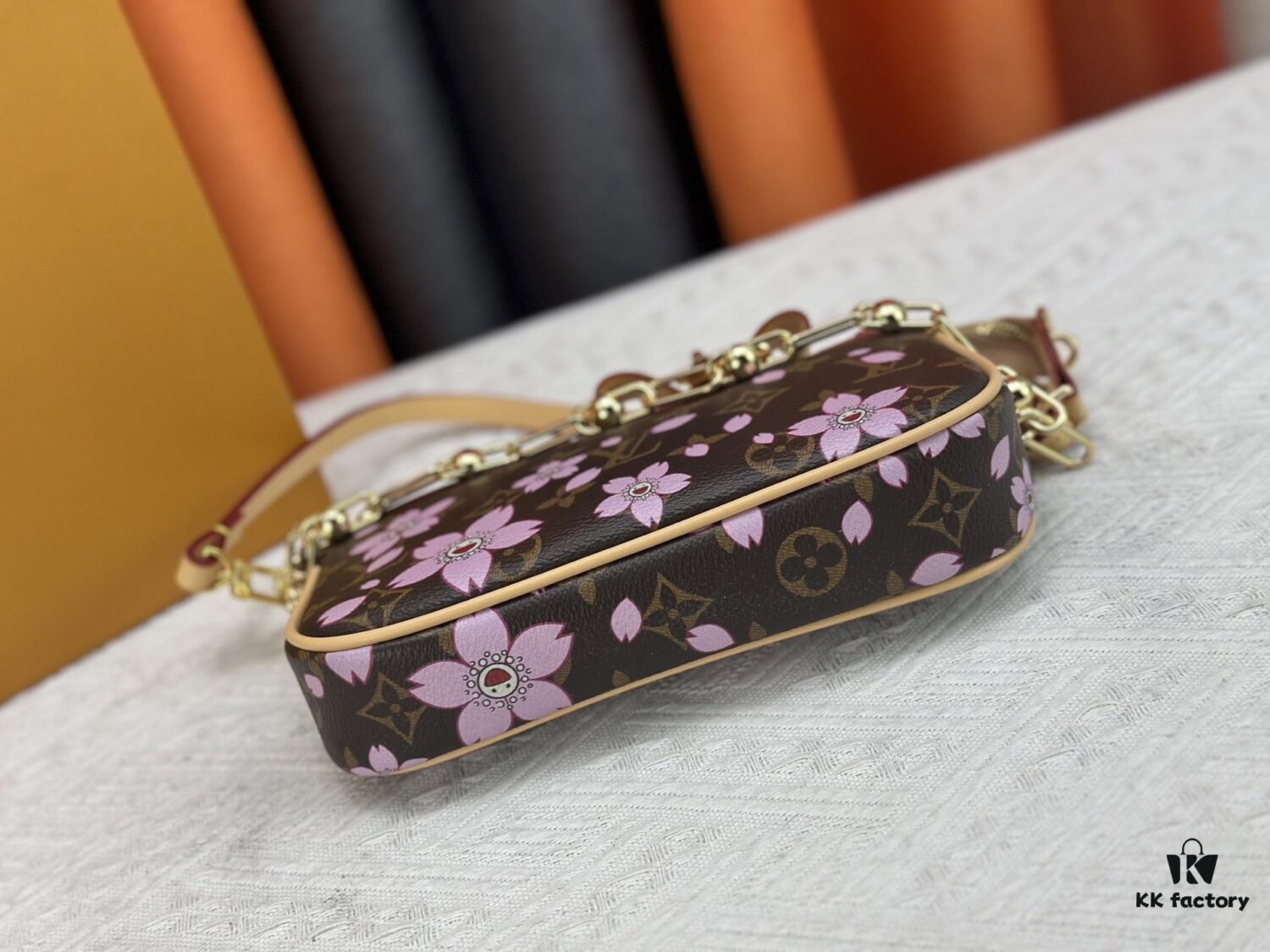 M13666 Pochette Accessoires Bag – A playful interpretation of the iconic Monogram canvas with Takashi Murakami's vibrant Cherry Blossom motif, revisiting the Louis Vuitton x Murakami collaboration with bold, whimsical style.