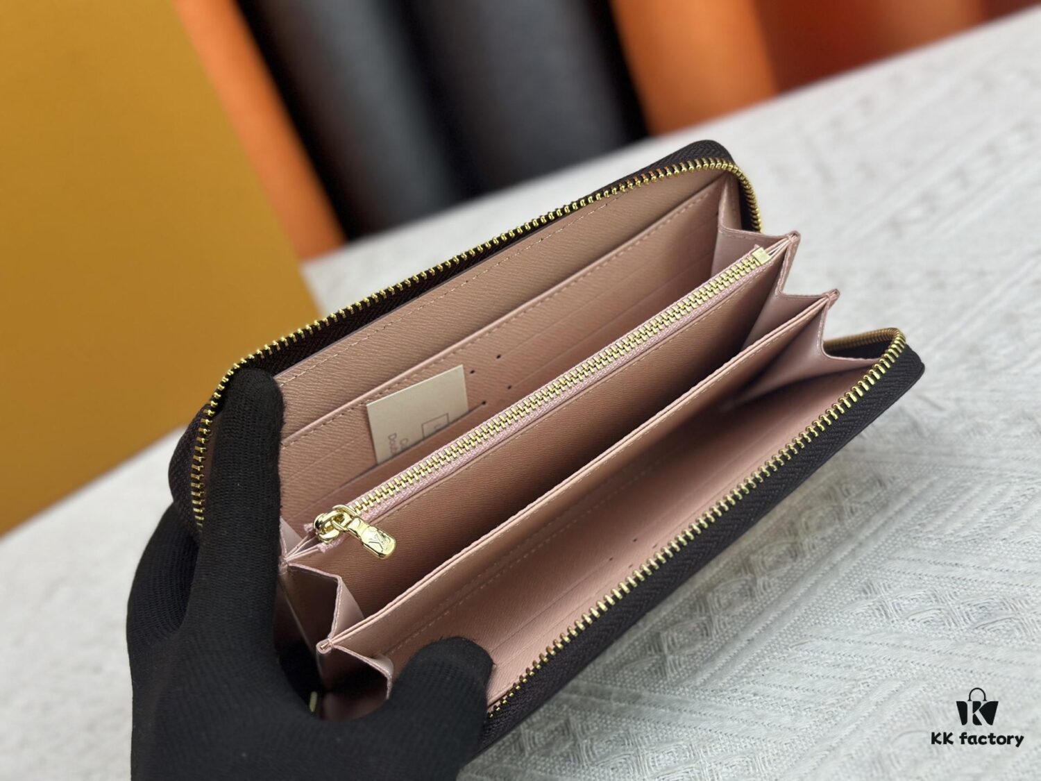 Wallet M60017 Umbrella M80857 M81544 This collectible multicolored zip-around wallet is crafted from Monogram canvas from the Vivienne Holidays 2022 collection, featuring an exquisite print of Louis Vuitton's mascot Vivienne standing in front of the brand's avant-garde Tokyo boutique with Japan's iconic Mount Fuji in the background. This vibrant high-end wallet serves as an invitation to journey and makes a perfect gift.