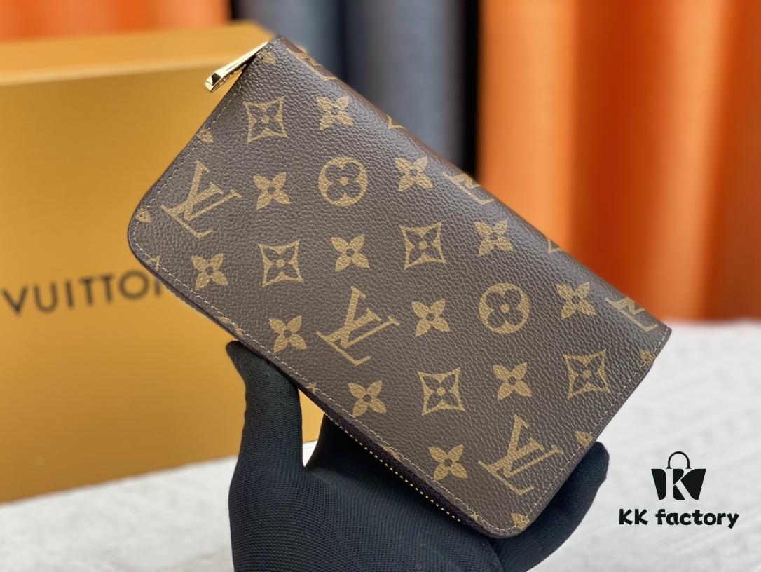 Wallet M80767 Imprint - A collectible multi-compartment zip-around wallet crafted from Monogram canvas, part of the Vivienne Holidays 2022 collection, featuring an exquisite print of Louis Vuitton's mascot Vivienne standing in front of the brand's avant-garde Tokyo boutique with Japan's iconic Mount Fuji in the background. This vibrant and sophisticated wallet serves as an invitation to journey and makes a perfect gift.