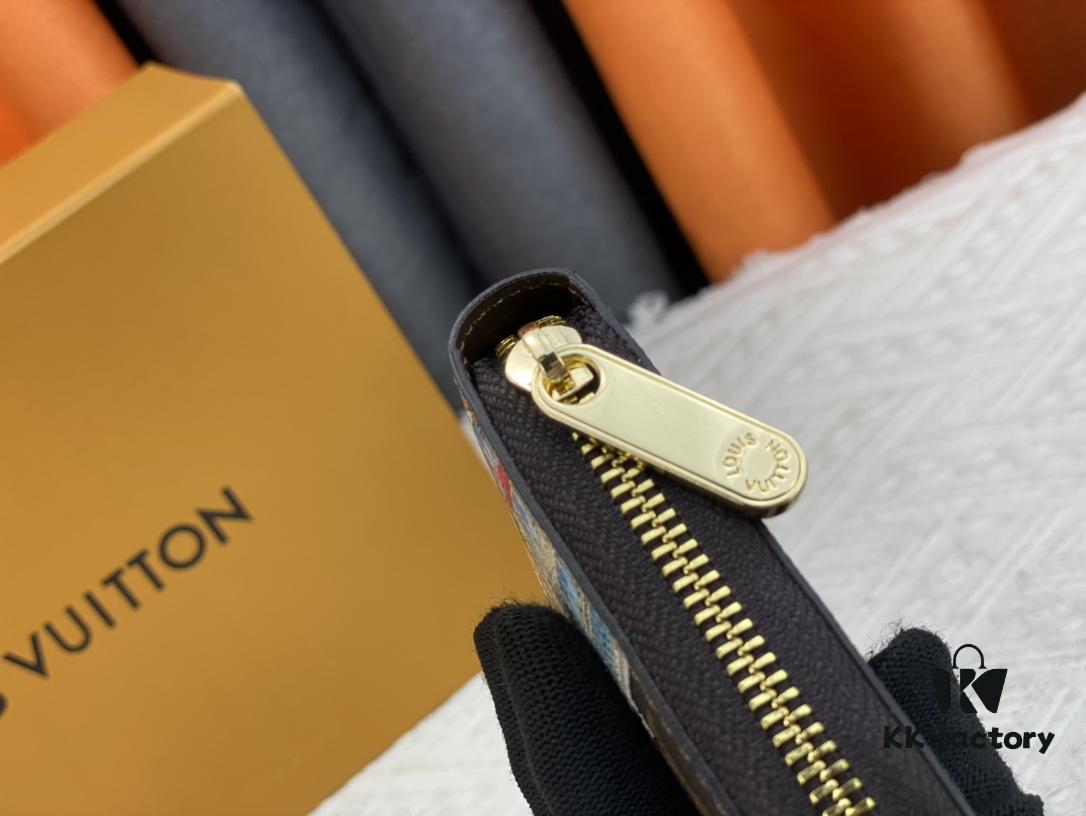 Wallet M80767 Imprint - A collectible multi-compartment zip-around wallet crafted from Monogram canvas, part of the Vivienne Holidays 2022 collection, featuring an exquisite print of Louis Vuitton's mascot Vivienne standing in front of the brand's avant-garde Tokyo boutique with Japan's iconic Mount Fuji in the background. This vibrant and sophisticated wallet serves as an invitation to journey and makes a perfect gift.