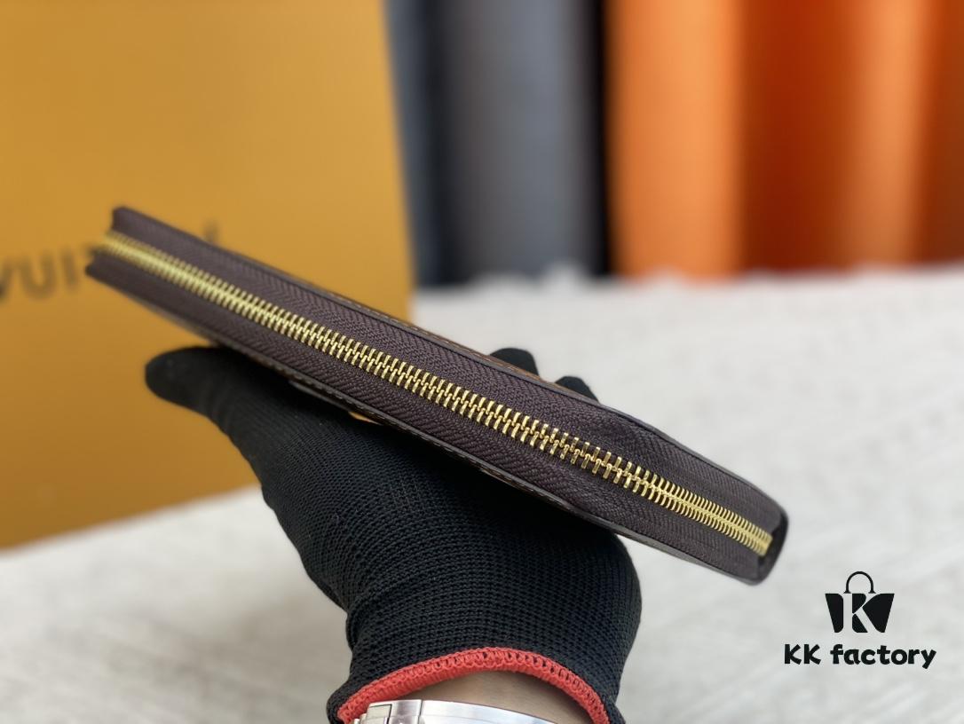 Wallet M80767 Imprint - A collectible multi-compartment zip-around wallet crafted from Monogram canvas, part of the Vivienne Holidays 2022 collection, featuring an exquisite print of Louis Vuitton's mascot Vivienne standing in front of the brand's avant-garde Tokyo boutique with Japan's iconic Mount Fuji in the background. This vibrant and sophisticated wallet serves as an invitation to journey and makes a perfect gift.