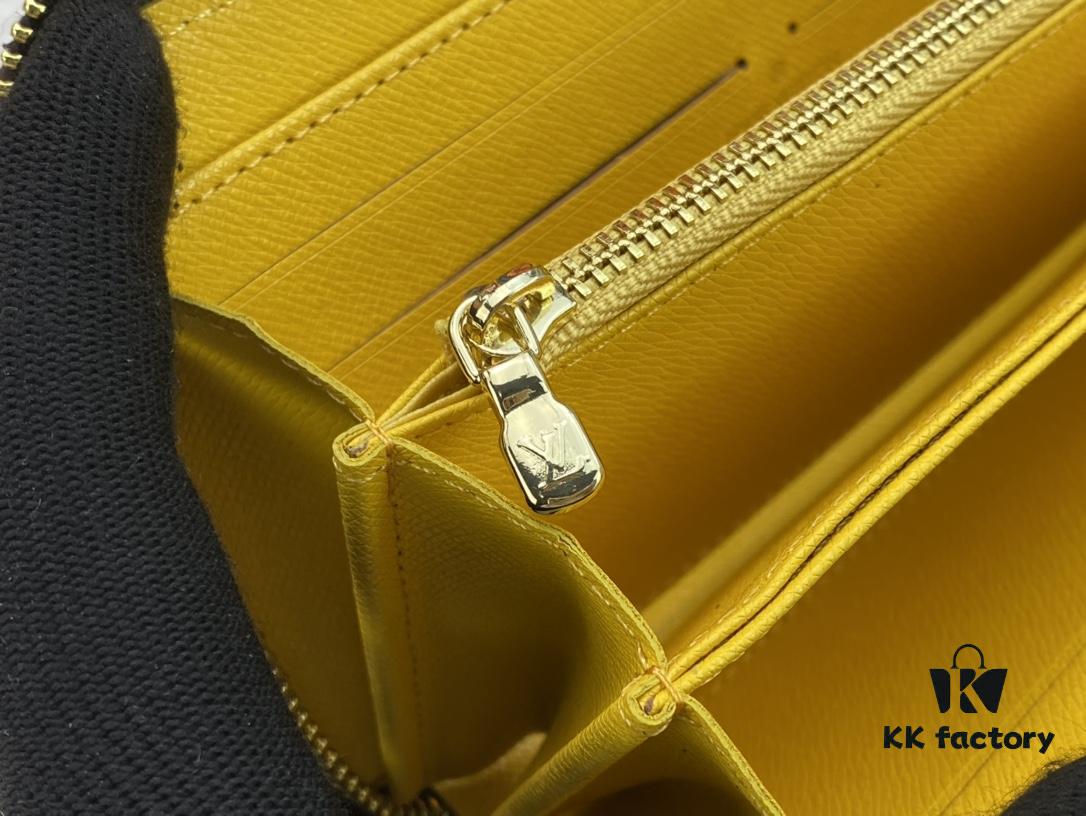 Wallet M80767 Imprint - A collectible multi-compartment zip-around wallet crafted from Monogram canvas, part of the Vivienne Holidays 2022 collection, featuring an exquisite print of Louis Vuitton's mascot Vivienne standing in front of the brand's avant-garde Tokyo boutique with Japan's iconic Mount Fuji in the background. This vibrant and sophisticated wallet serves as an invitation to journey and makes a perfect gift.