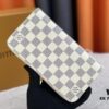 Wallet M82839 White Check This collectible multi-compartment zip wallet is crafted from Monogram canvas from the Vivienne Holidays 2022 collection, featuring a delicate print of Vivienne, Louis Vuitton's mascot, standing in front of the brand's avant-garde Tokyo boutique with Japan's iconic Mount Fuji in the background. This vibrant high-end wallet feels like an invitation to travel and makes a perfect gift.