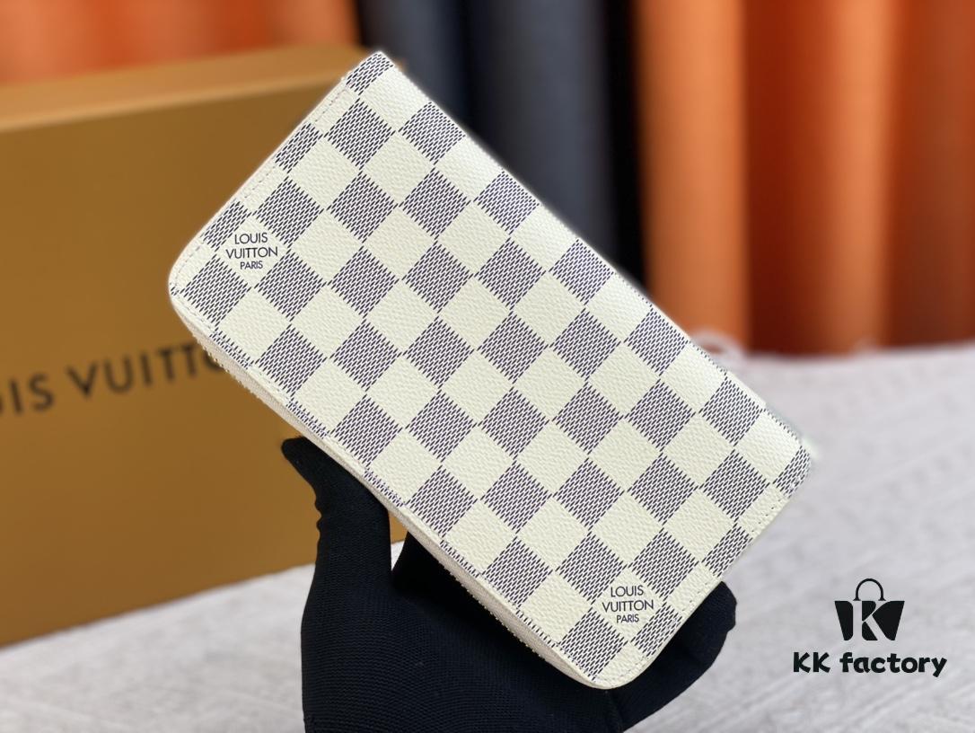 Wallet M82839 White Check This collectible multi-compartment zip wallet is crafted from Monogram canvas from the Vivienne Holidays 2022 collection, featuring a delicate print of Vivienne, Louis Vuitton's mascot, standing in front of the brand's avant-garde Tokyo boutique with Japan's iconic Mount Fuji in the background. This vibrant high-end wallet feels like an invitation to travel and makes a perfect gift.