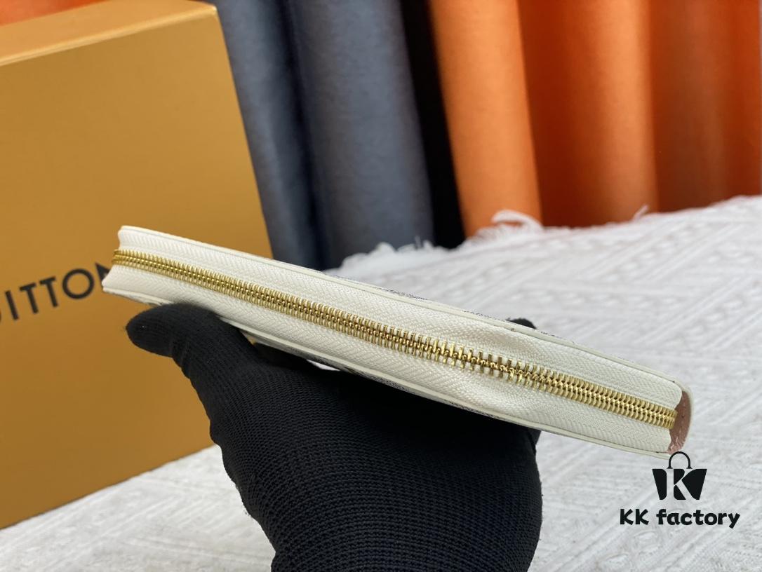 Wallet M82839 White Check This collectible multi-compartment zip wallet is crafted from Monogram canvas from the Vivienne Holidays 2022 collection, featuring a delicate print of Vivienne, Louis Vuitton's mascot, standing in front of the brand's avant-garde Tokyo boutique with Japan's iconic Mount Fuji in the background. This vibrant high-end wallet feels like an invitation to travel and makes a perfect gift.