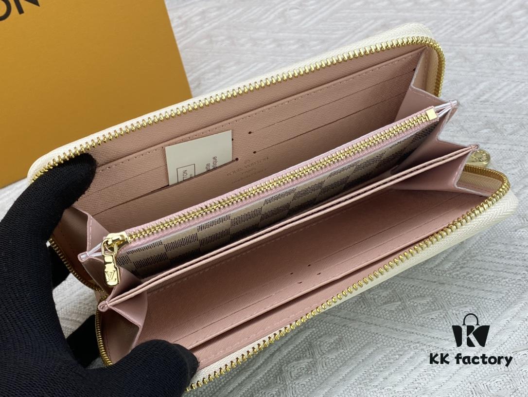 Wallet M82839 White Check This collectible multi-compartment zip wallet is crafted from Monogram canvas from the Vivienne Holidays 2022 collection, featuring a delicate print of Vivienne, Louis Vuitton's mascot, standing in front of the brand's avant-garde Tokyo boutique with Japan's iconic Mount Fuji in the background. This vibrant high-end wallet feels like an invitation to travel and makes a perfect gift.