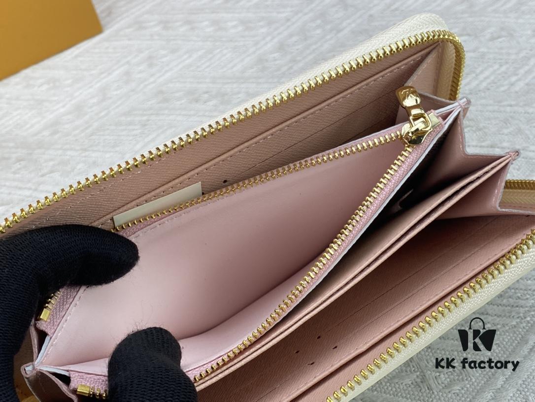 Wallet M82839 White Check This collectible multi-compartment zip wallet is crafted from Monogram canvas from the Vivienne Holidays 2022 collection, featuring a delicate print of Vivienne, Louis Vuitton's mascot, standing in front of the brand's avant-garde Tokyo boutique with Japan's iconic Mount Fuji in the background. This vibrant high-end wallet feels like an invitation to travel and makes a perfect gift.