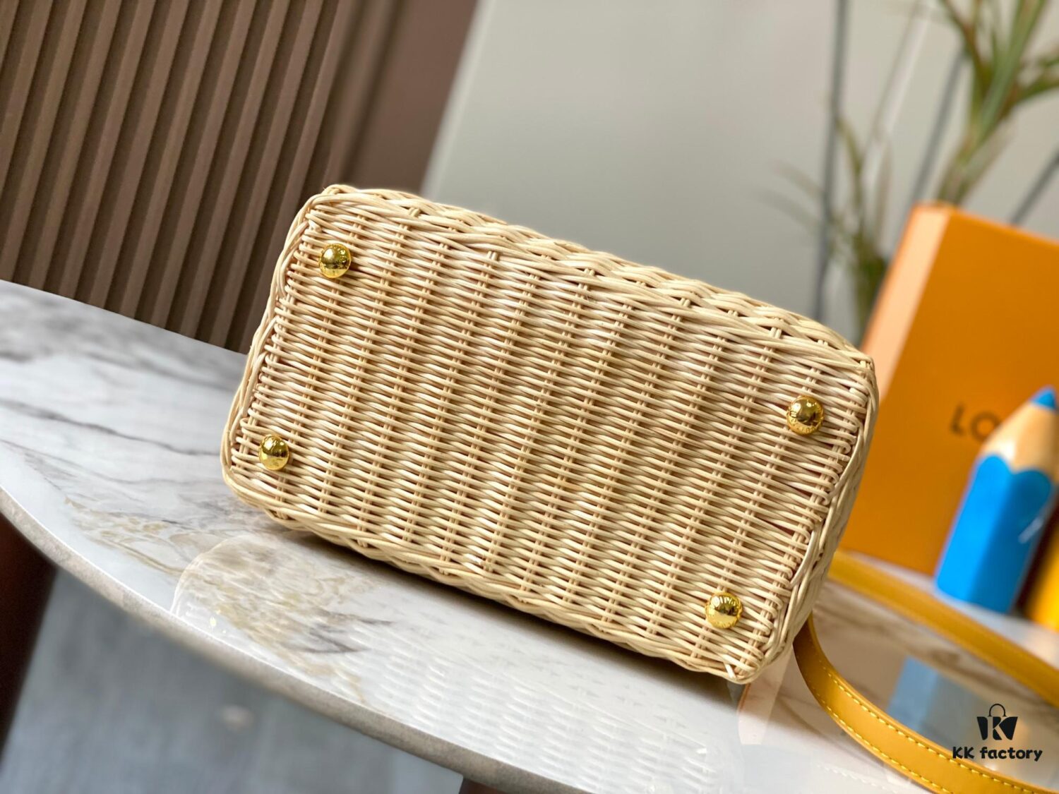 Upgraded M11617 Capucines BB Handbag featuring a woven rattan design inspired by the 1892 Louis Vuitton picnic trunk, crafted with cowhide leather handles and flap, metallic LV logo, detachable and adjustable leather shoulder strap for crossbody wear. Packaging may vary based on availability.