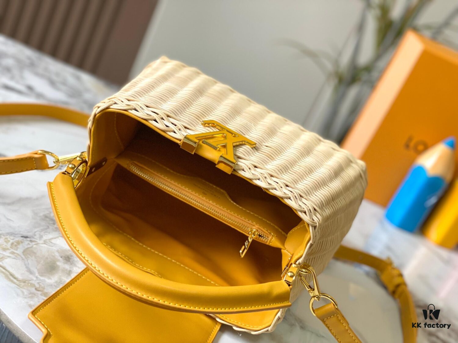 Upgraded M11617 Capucines BB Handbag featuring a woven rattan design inspired by the 1892 Louis Vuitton picnic trunk, crafted with cowhide leather handles and flap, metallic LV logo, detachable and adjustable leather shoulder strap for crossbody wear. Packaging may vary based on availability.